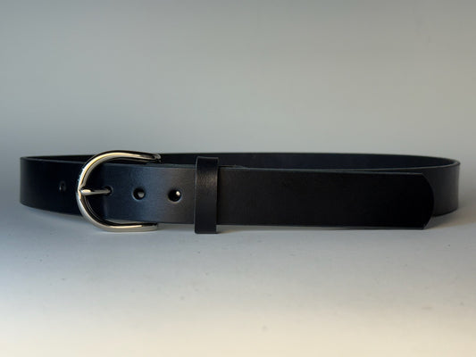 Black leather belt with a silver buckle on a gray background